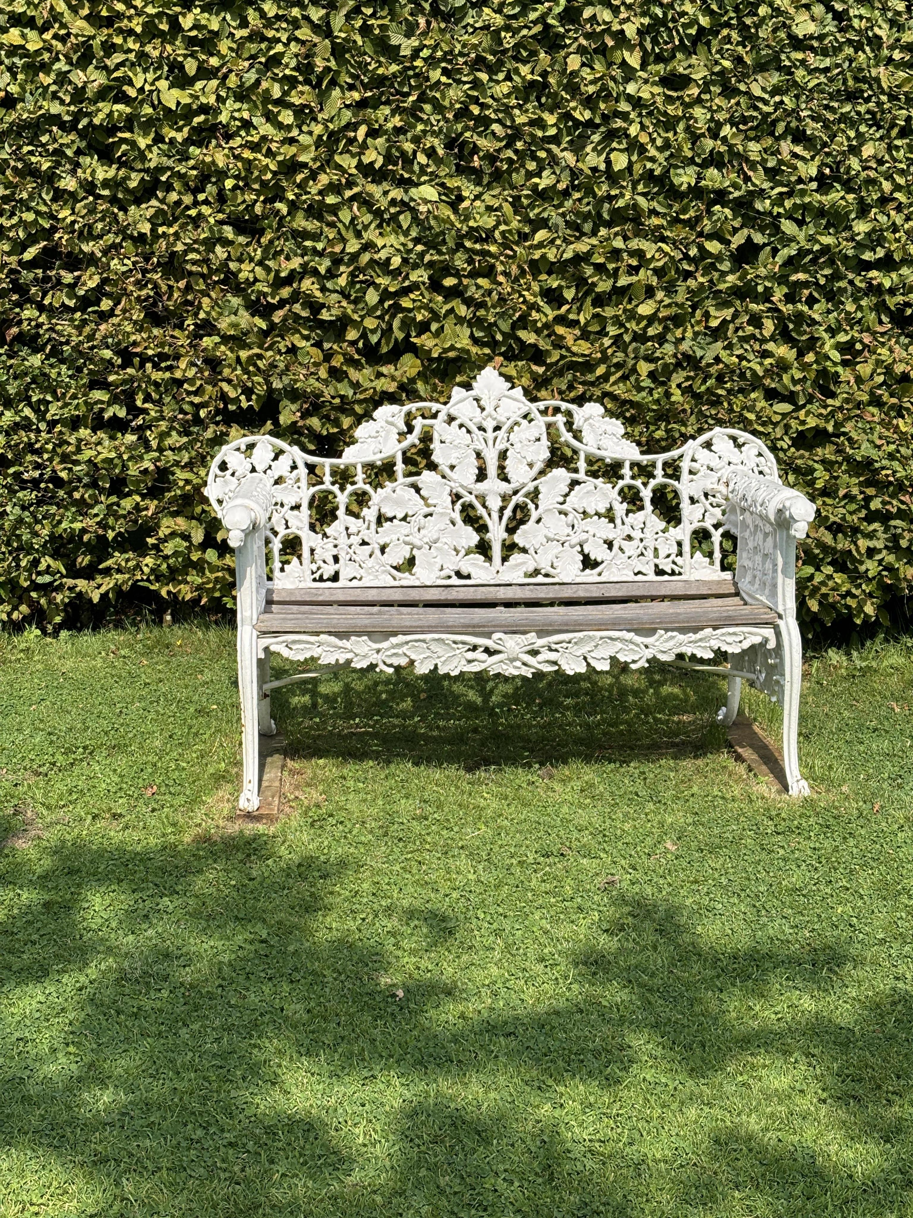 A pair of Coalbrookdale style cast iron garden benches